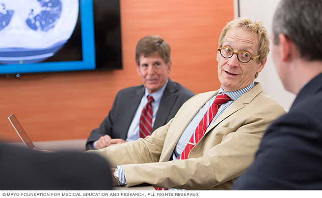 A group of doctors talking in a meeting