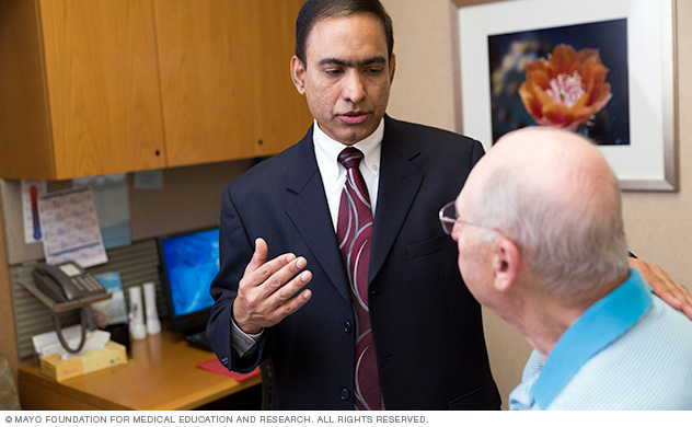 A doctor consulting with a patient.