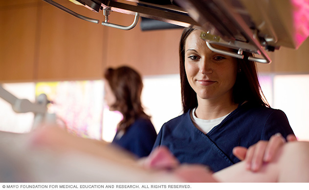 A physician explaining a diagnostic image to a patient