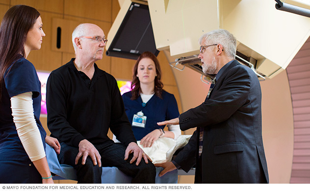 Mayo care team and patient discuss proton beam procedure