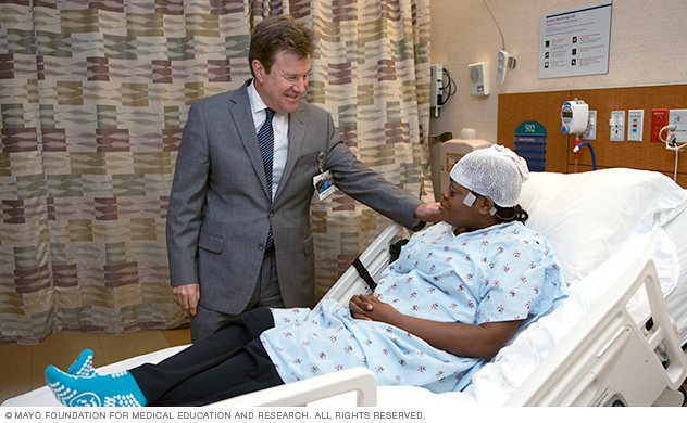 Doctor comforting patient during testing