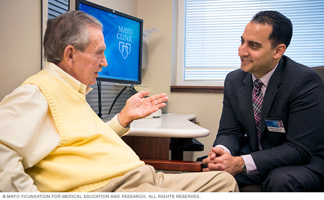 Doctor talking with patient