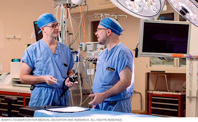 Surgeons having a discussion in a procedure room