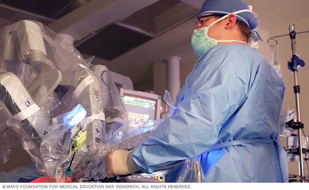 An endocrine surgeon performs robotic surgery at the console.