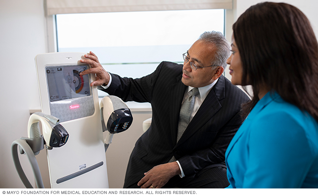 A Mayo physician discusses a potential procedure with a patient.