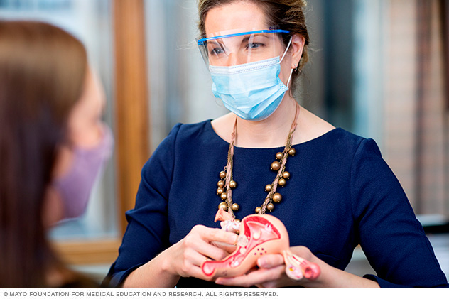 A Fibroid Clinic doctor uses a 3D model to help explain fibroids.