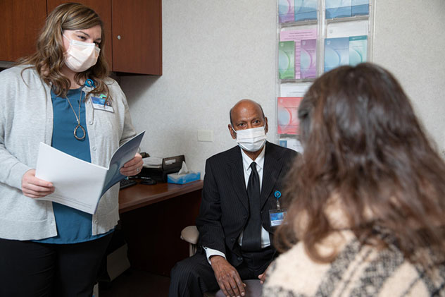 A Pancreas Clinic care team meets with a patient.