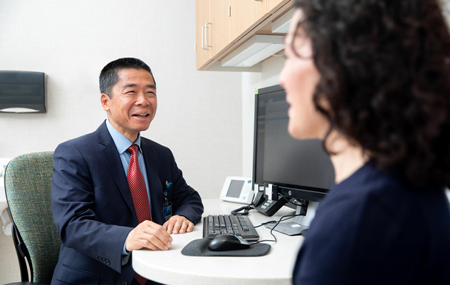 A cardiologist at Mayo Clinic in Minnesota talks with a patient.