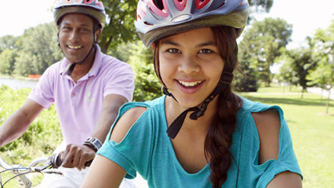 Photo of two people riding bikes