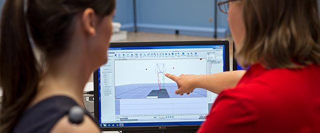 Picture of researchers working on a computer in the Motion Analysis Lab at Mayo Clinic.