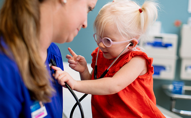 Mayo healthcare provider and baby girl.