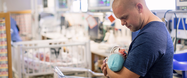 Man holding infant