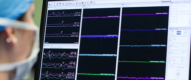 Clinician viewing hearing data on computer monitor