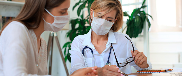 Health care provider and patient looking at papers