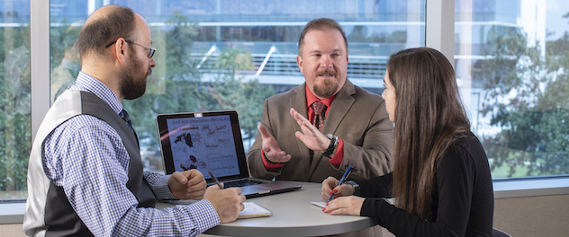 Team members discussing research projects