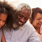 Senior couple playing with children