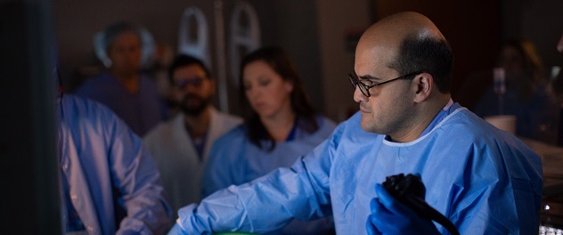 Dr. Abu Dayyeh works with colleagues in a clinical setting