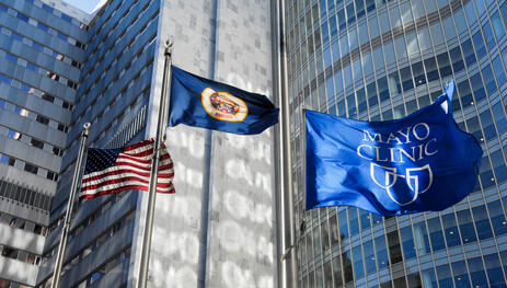 American flag, Minnesota state flag and Mayo Clinic flag flying at Mayo Clinic