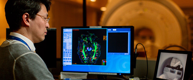 Researcher using MRI