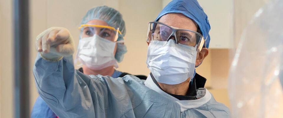 Two healthcare professionals in catheterization laboratory