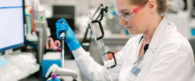 Researcher pipetting in a lab